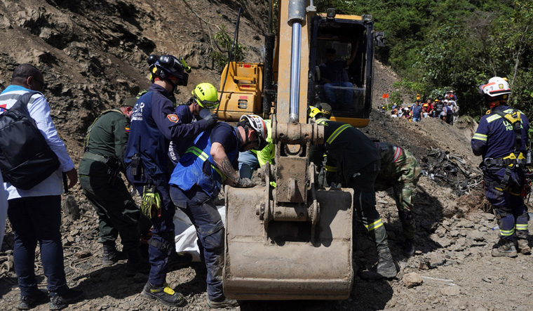 Mudslide swallows bus on Colombian highway, 34 killed